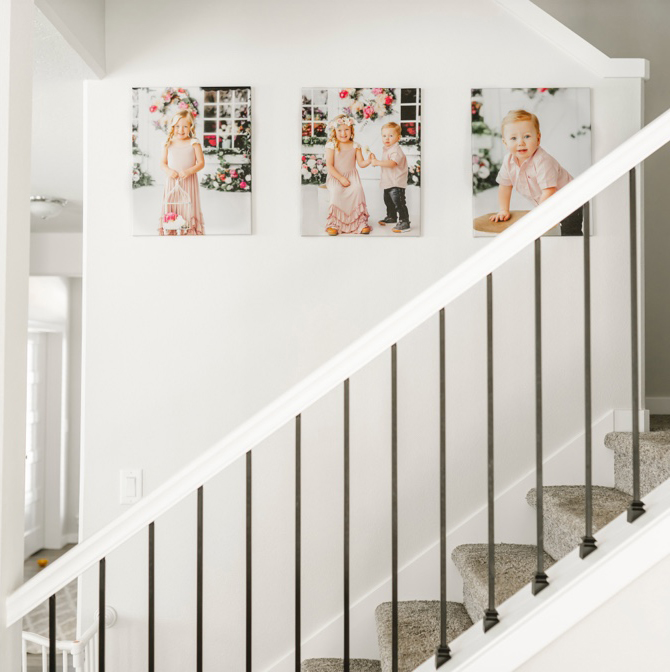 Canvas gallery wall over staircase